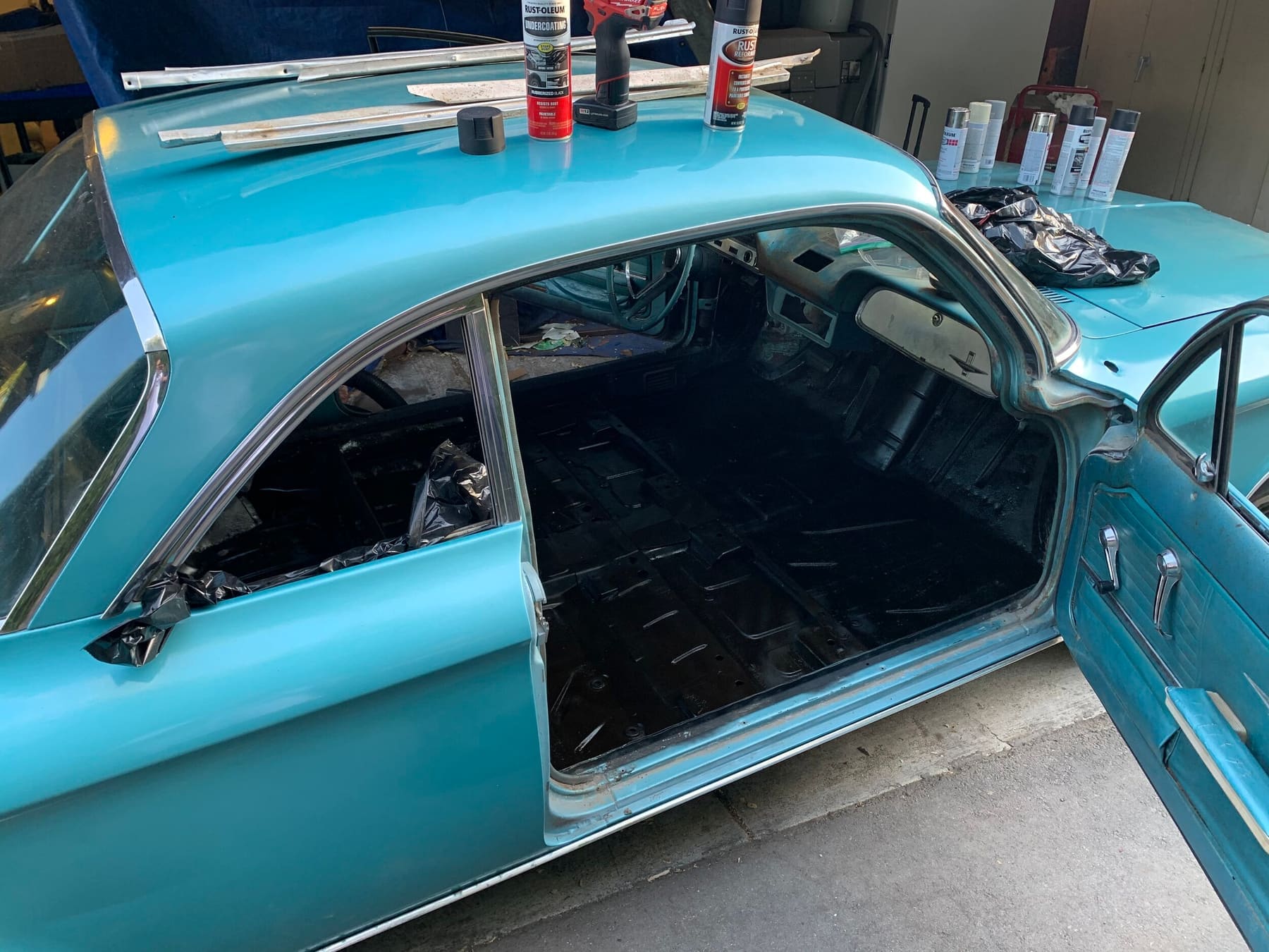 Stripped interior with the floorpan sealed and sound-deadened