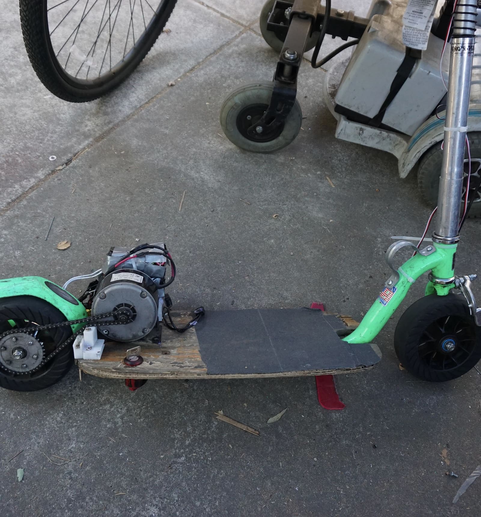 Electric scooter with its brushed motor and chain drive